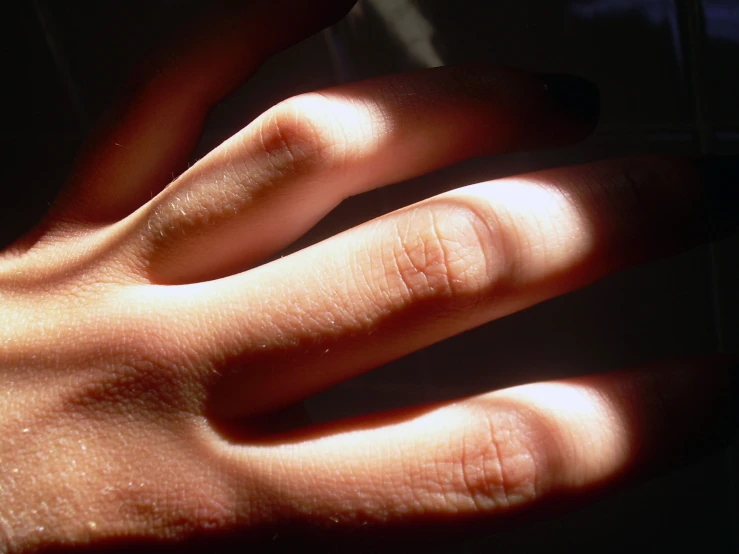 close up s of a person holding their fingers together