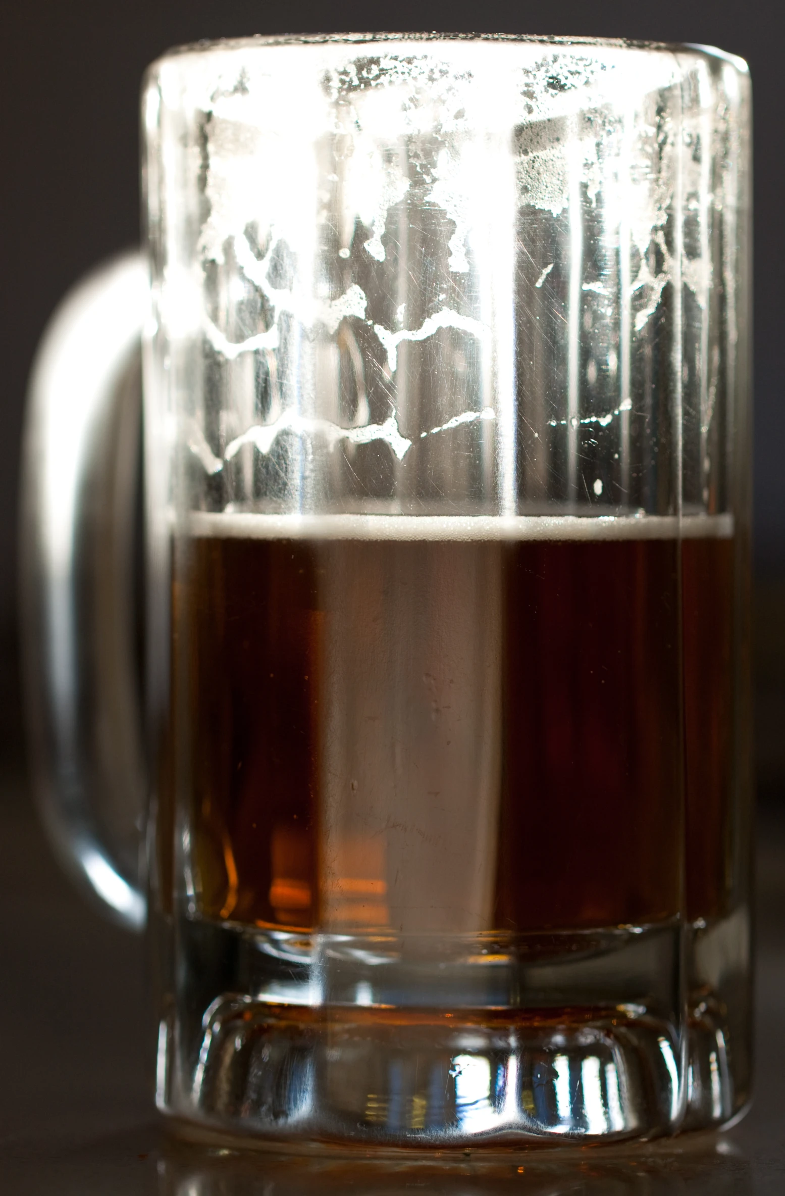 a glass filled with liquid on top of a table