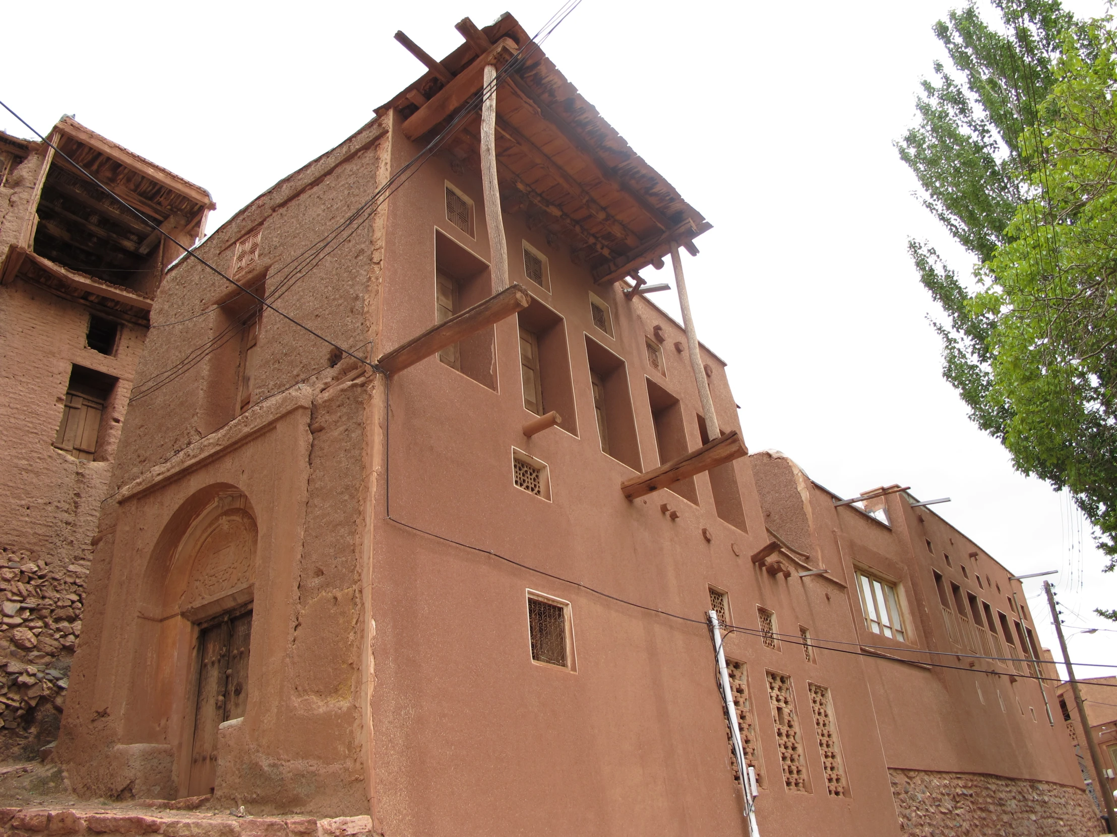 a large stone building is near the road