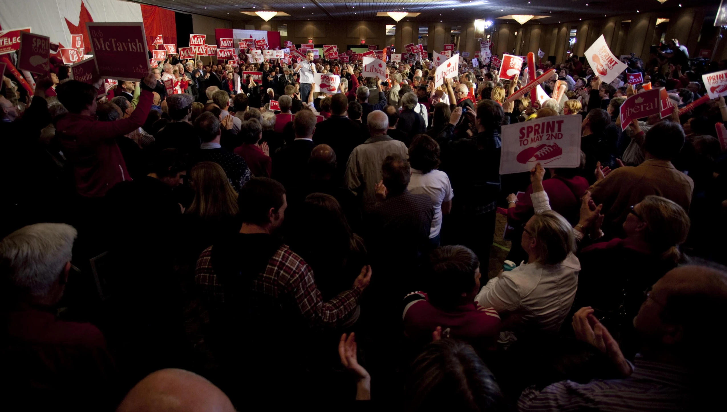 there are many people gathered together at a political event