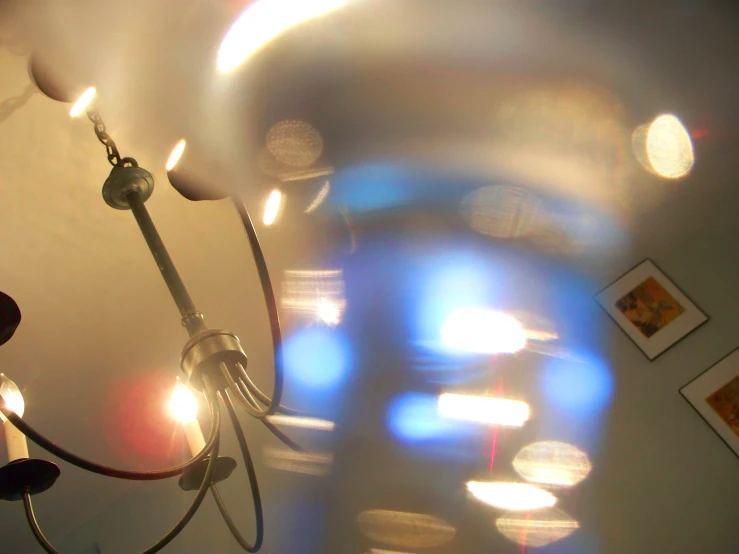 a chandelier hanging from the ceiling in a room