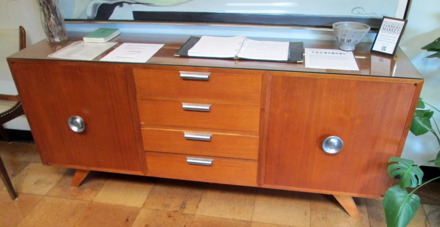 an old style dresser with three drawers in the middle