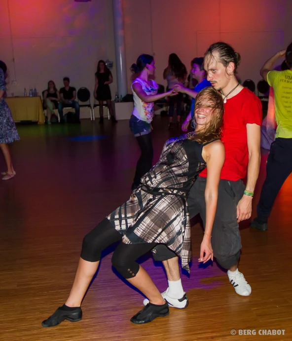 a group of people who are on a dance floor