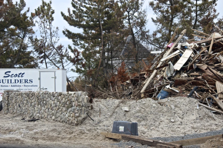 a pile of rubble and rubble that has been placed next to a sign that says scott boulevard butleries