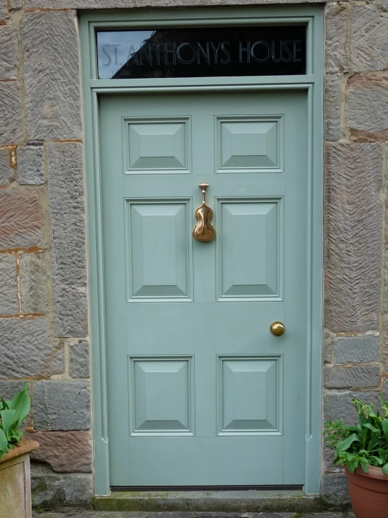 green door of a business in the city