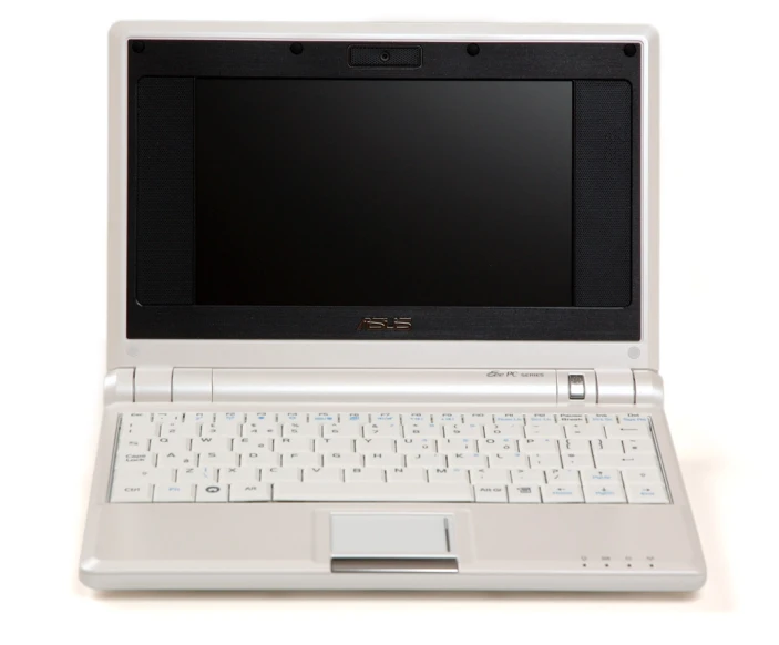 a laptop computer on top of a white desk