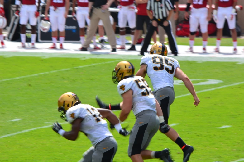 football players run for the game goal