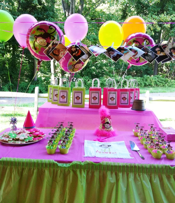an elaborately decorated table set up for a girl's birthday