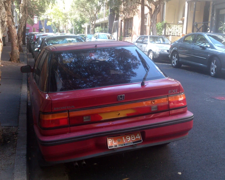 a car parked on the street next to a road