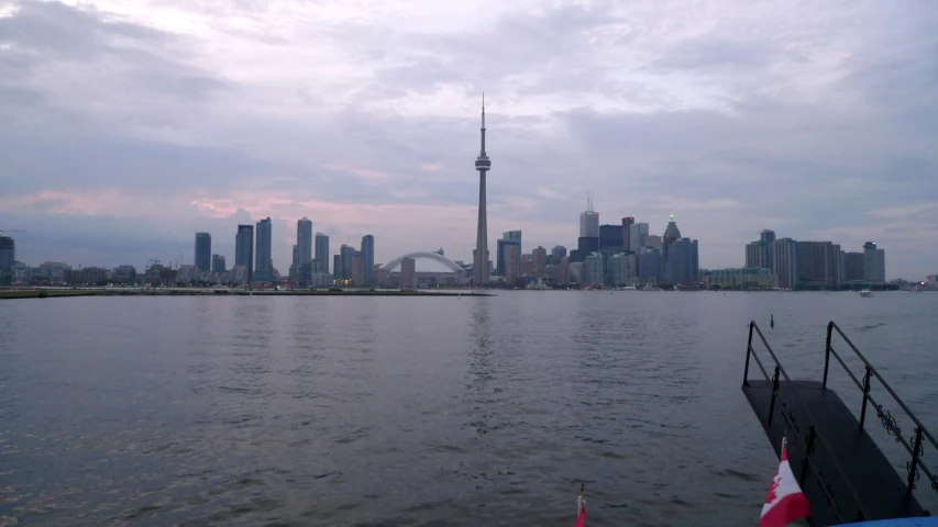 the city of toronto is visible across a lake