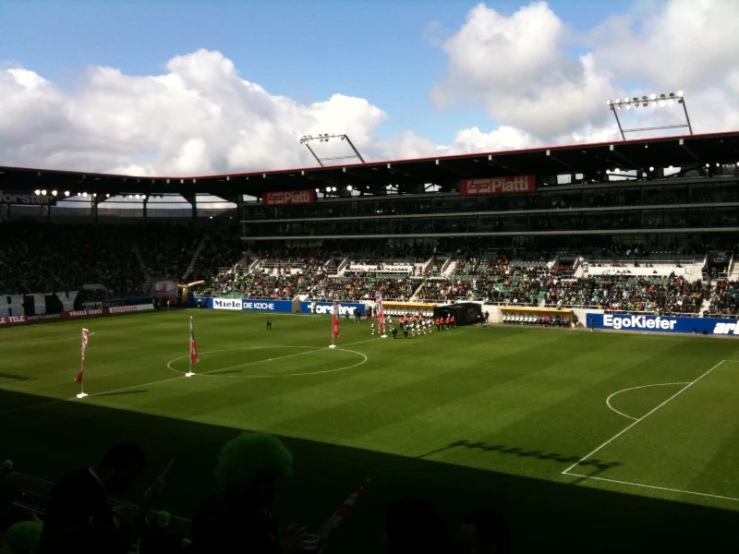 the crowd watching a soccer game from the stands