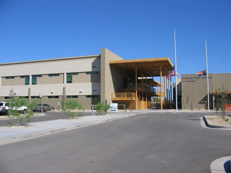 large building with parking lot in front of it