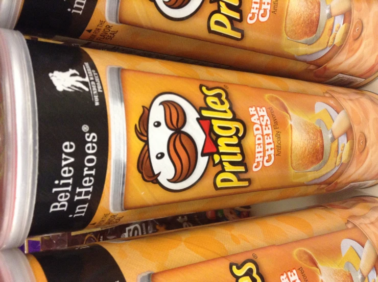 three canisters of pringles are lined up