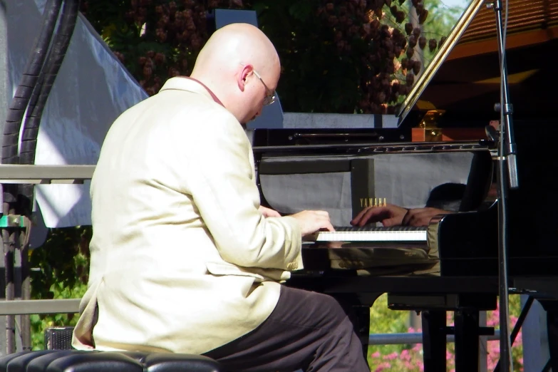 an image of a man that is playing piano