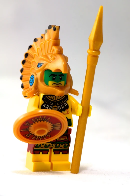 an image of a toy that is holding a spear