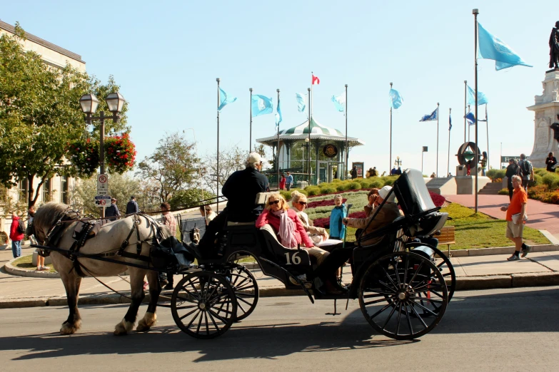 horse drawn carriages, with people in it