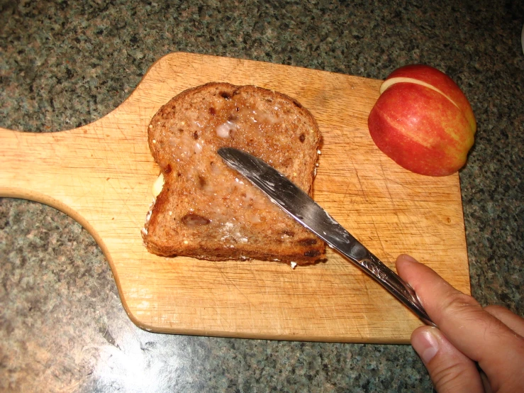 a person slicing up food with a knife