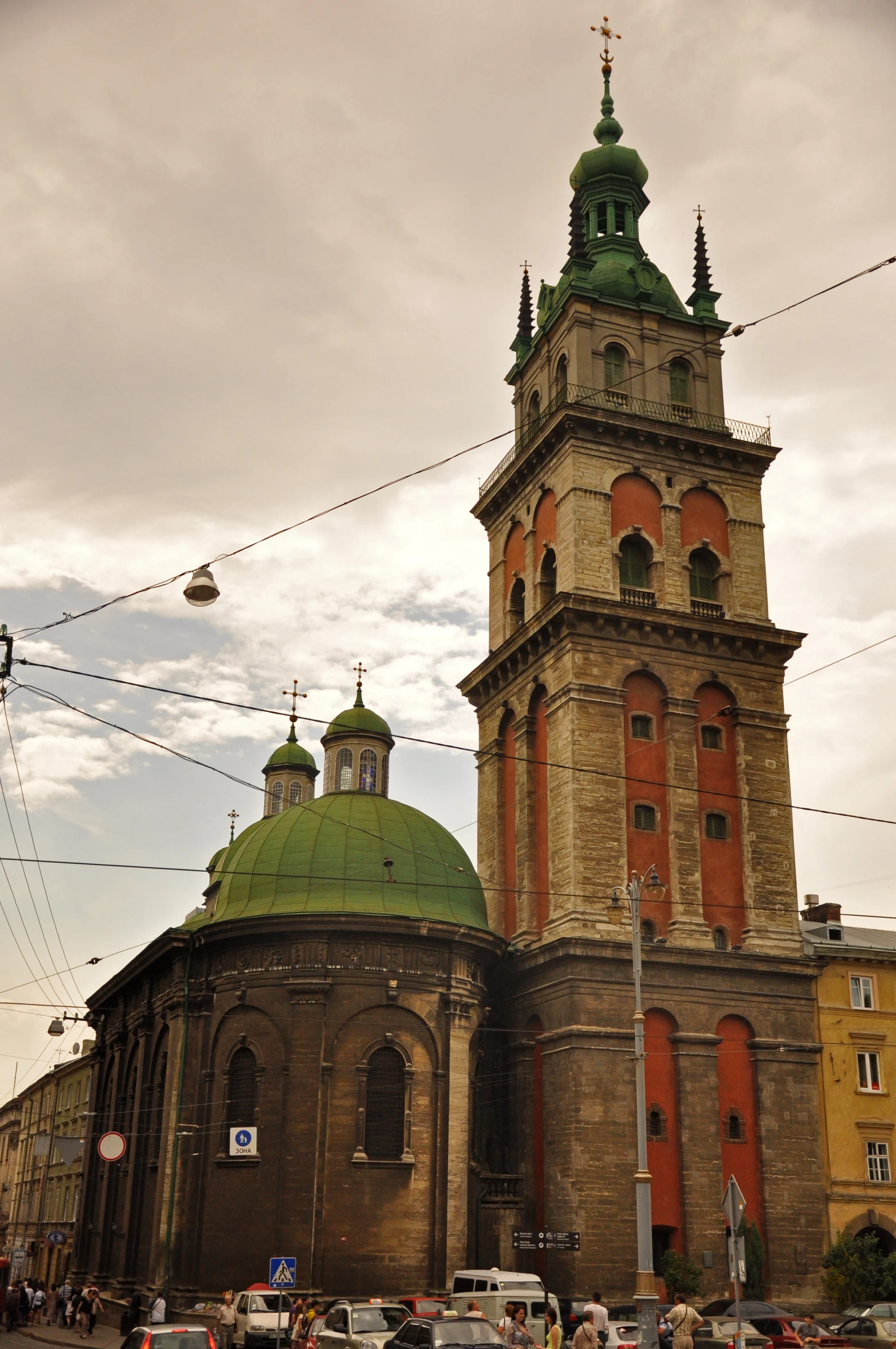 the large, ornate building has two towers and a spire