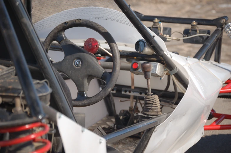 a close up view of the steering wheel and driver side of an off - road vehicle