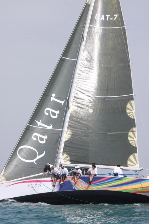 a sailboat is seen in the ocean on a sunny day