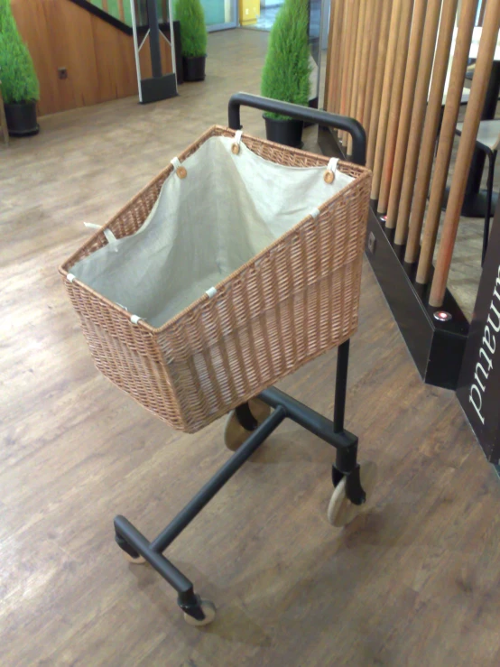 a wicker shopping cart on display in a store