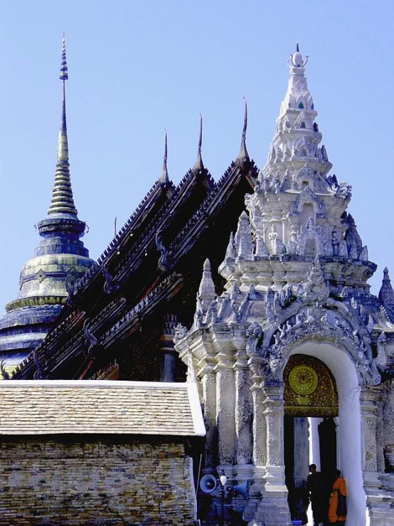 white statues, and ornate structures are all around this building