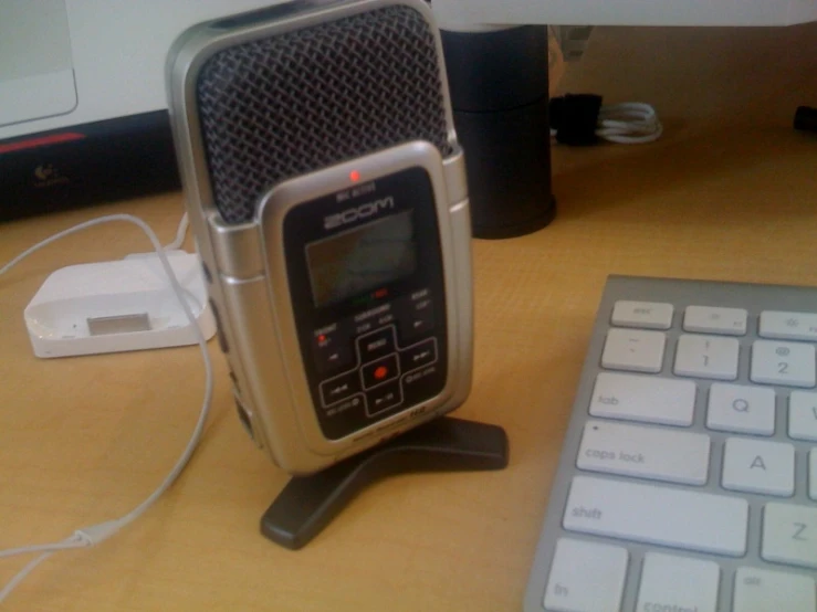 there is a radio sitting next to the keyboard