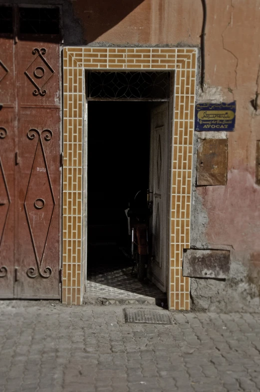 an entrance into a building with a person in a chair