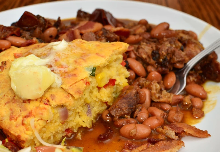 breakfast plate with eggs and beans on top