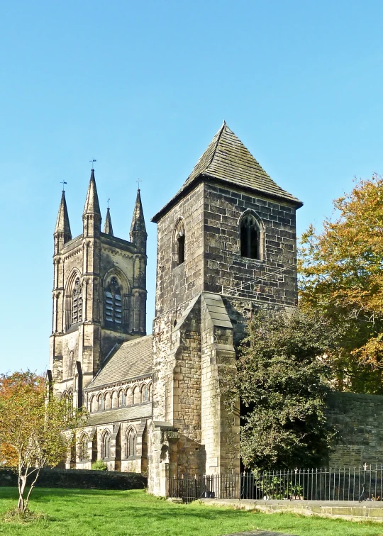 the tall brick cathedral has steeple spires