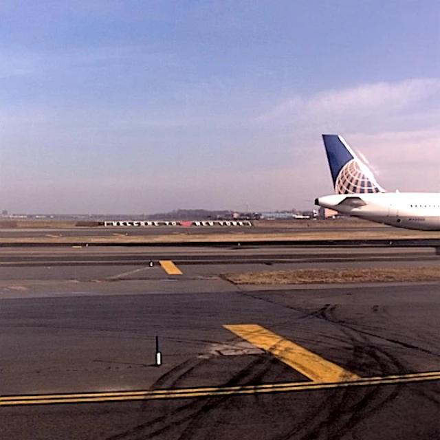 three airplanes are on the tarmac of an airport