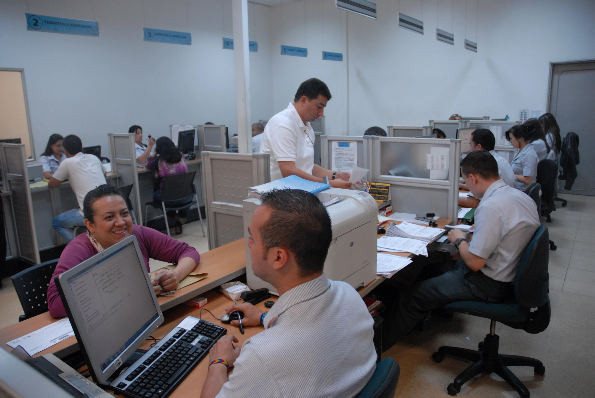 some office workers working on laptops in the office