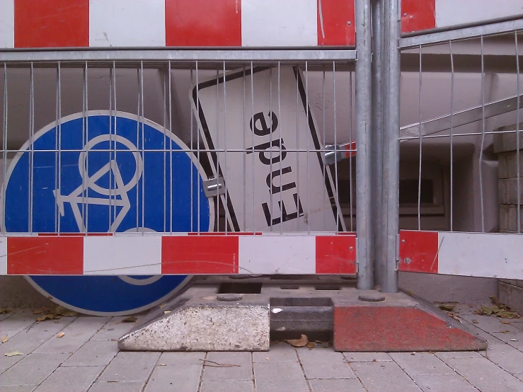 a gate is blocked off with an open sign