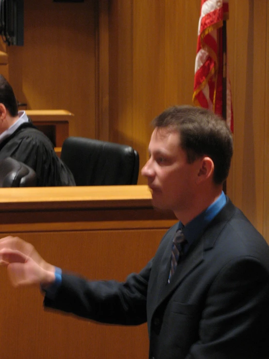 the man is giving his speech during the trial