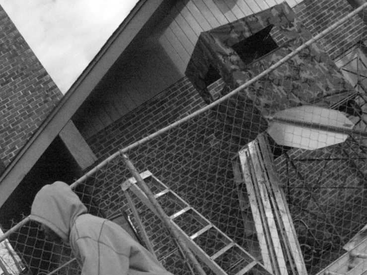 a person's feet are standing near an old abandoned stairway