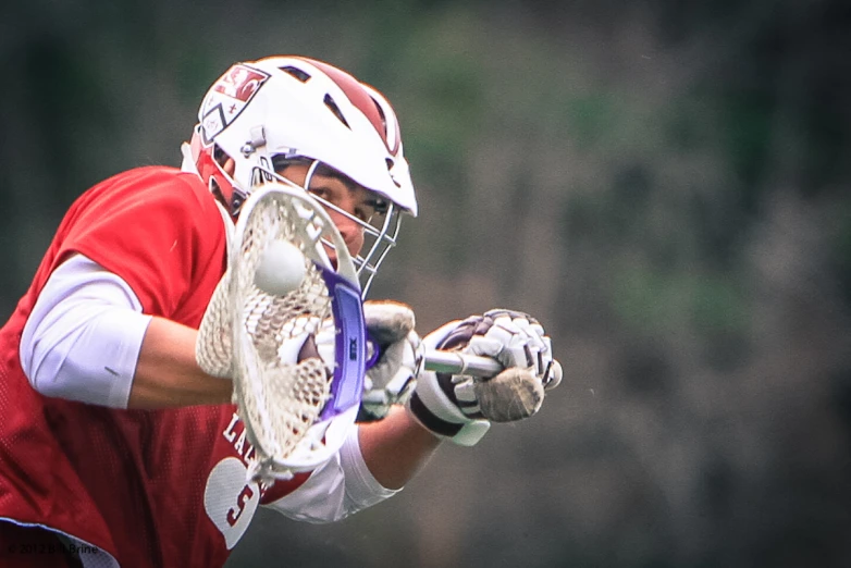 a young lacrosse player preparing to hit the ball