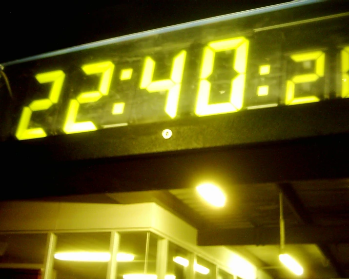 a gas station sign with the time displayed