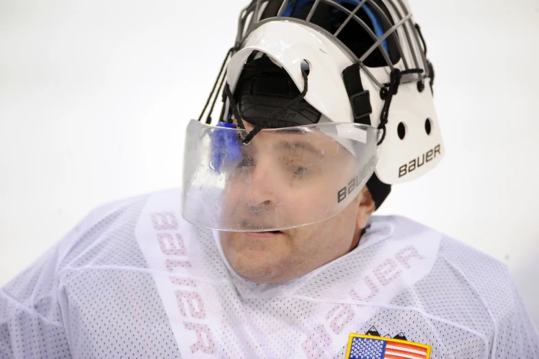 hockey coach with an inflatable mask and goggles