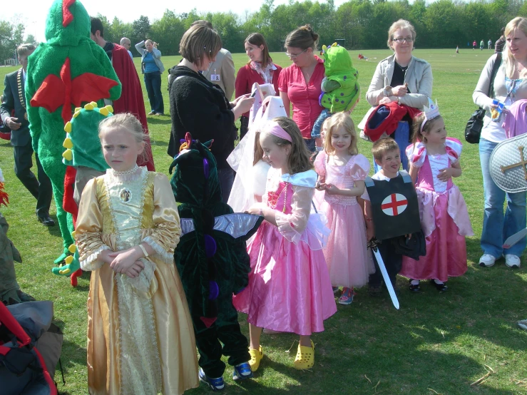 young children in costumes at the park