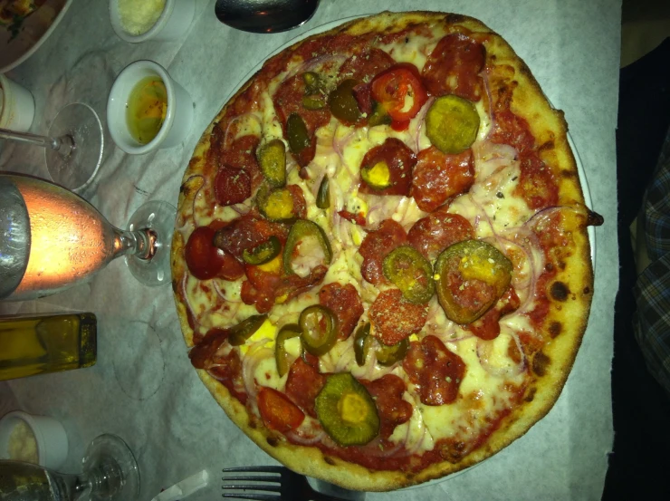 a very small pizza on a white table cloth