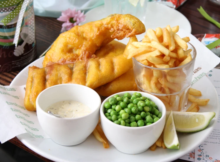 the plate has different kinds of fish and chips