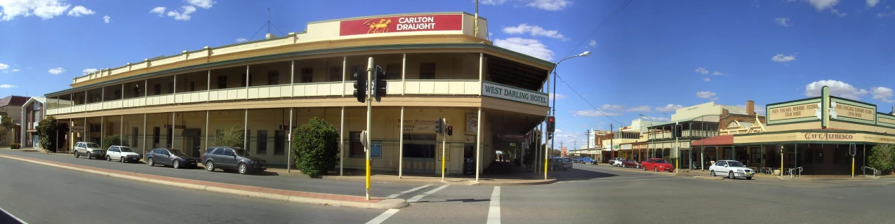 two street view pictures showing cars in the middle of an empty street