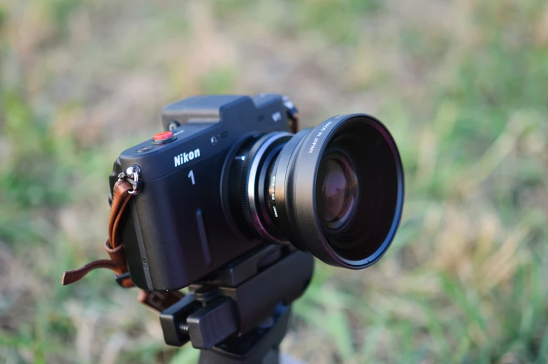 a camera is shown on the ground in a field