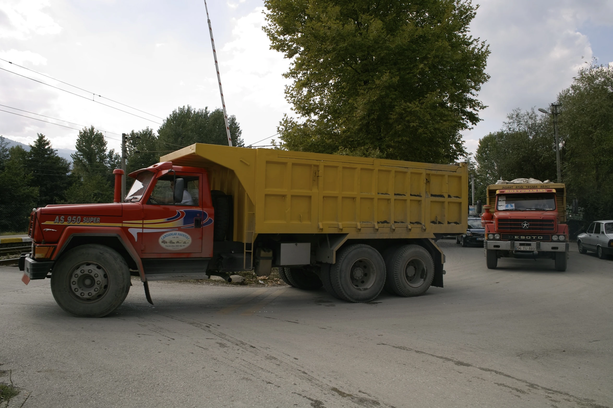 two large trucks in a parking lot