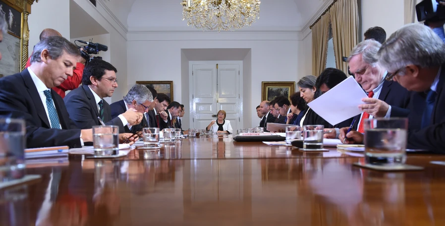 a group of people at a long table