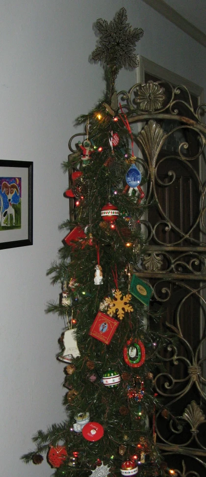 a small tree decorated with colorful christmas ornaments