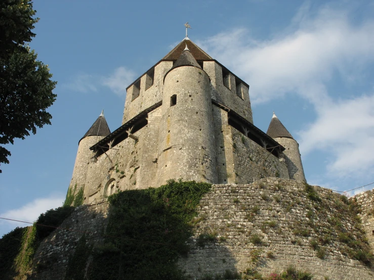 a tall castle with a sky background