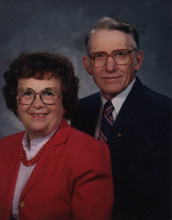 the man and woman are standing close together