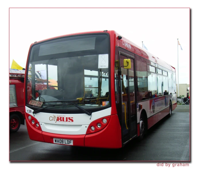 large passenger bus sitting on the street with its door open