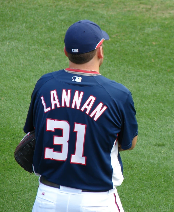 the man is playing baseball on the field